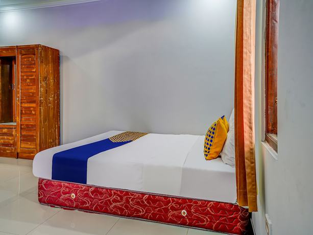 Imagen de la habitación del Hotel Oyo Homes 91014 Eco Tourism Desa Cibodas Areng 2 Syariah. Foto 10