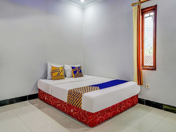 Imagen de la habitación del Hotel Oyo Homes 91014 Eco Tourism Desa Cibodas Areng 2 Syariah. Foto 11