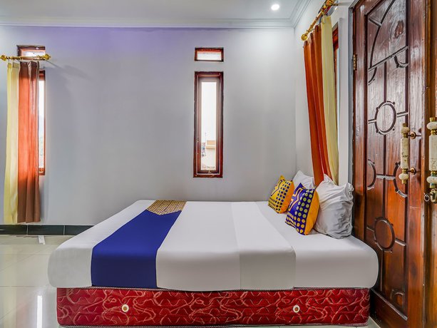 Imagen de la habitación del Hotel Oyo Homes 91014 Eco Tourism Desa Cibodas Areng 2 Syariah. Foto 13