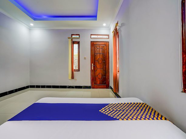 Imagen de la habitación del Hotel Oyo Homes 91014 Eco Tourism Desa Cibodas Areng 2 Syariah. Foto 14