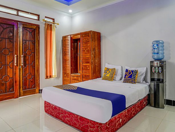 Imagen de la habitación del Hotel Oyo Homes 91014 Eco Tourism Desa Cibodas Areng 2 Syariah. Foto 15