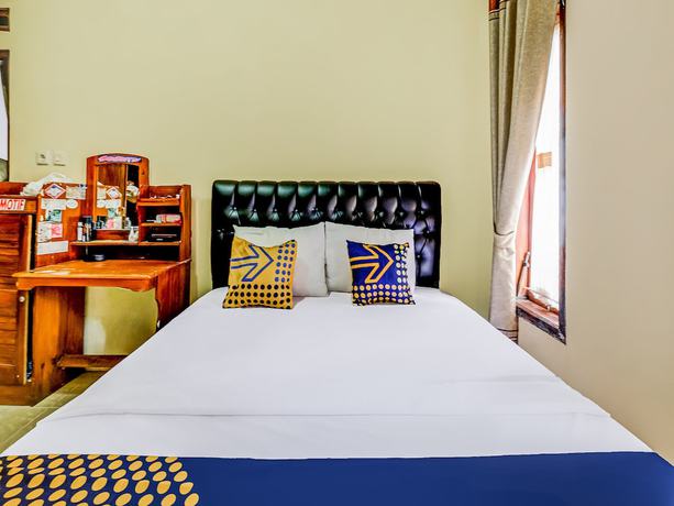 Imagen de la habitación del Hotel Oyo Homes 91067 Desa Wisata Santanamekar. Foto 6