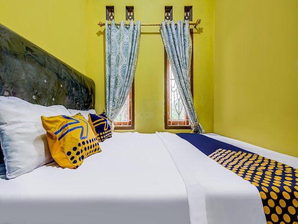 Imagen de la habitación del Hotel Oyo Homes 91067 Desa Wisata Santanamekar. Foto 12