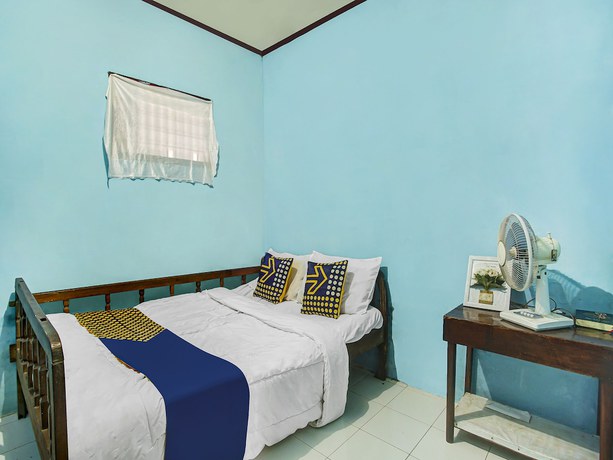 Imagen de la habitación del Hotel Oyo Homes 91089 Desa Wisata Air Terjun Way Kalam Syariah. Foto 2