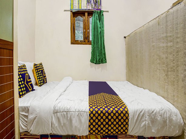 Imagen de la habitación del Hotel Oyo Homes 91089 Desa Wisata Air Terjun Way Kalam Syariah. Foto 3