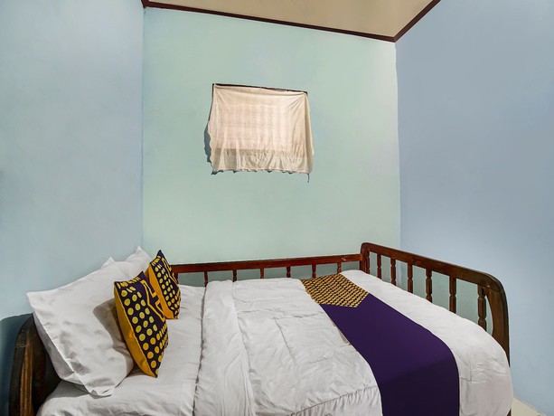 Imagen de la habitación del Hotel Oyo Homes 91089 Desa Wisata Air Terjun Way Kalam Syariah. Foto 6