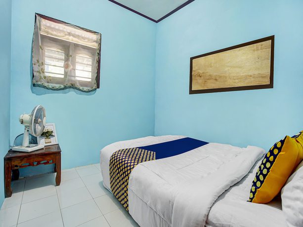 Imagen de la habitación del Hotel Oyo Homes 91089 Desa Wisata Air Terjun Way Kalam Syariah. Foto 7