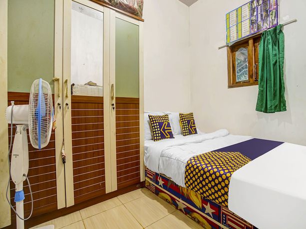 Imagen de la habitación del Hotel Oyo Homes 91089 Desa Wisata Air Terjun Way Kalam Syariah. Foto 9