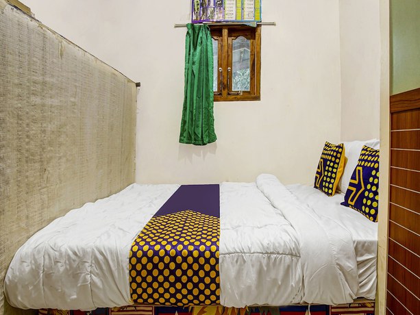 Imagen de la habitación del Hotel Oyo Homes 91089 Desa Wisata Air Terjun Way Kalam Syariah. Foto 10