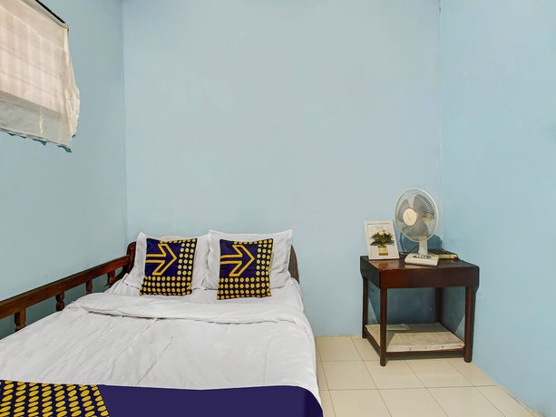 Imagen de la habitación del Hotel Oyo Homes 91089 Desa Wisata Air Terjun Way Kalam Syariah. Foto 11