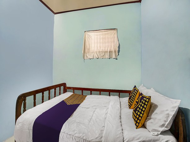 Imagen de la habitación del Hotel Oyo Homes 91089 Desa Wisata Air Terjun Way Kalam Syariah. Foto 15