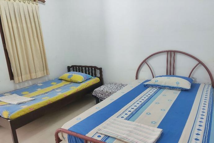 Imagen de la habitación del Hotel Oyo Homes 91098 Desa Wisata Tanjung Syariah. Foto 4