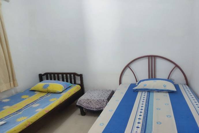 Imagen de la habitación del Hotel Oyo Homes 91098 Desa Wisata Tanjung Syariah. Foto 5
