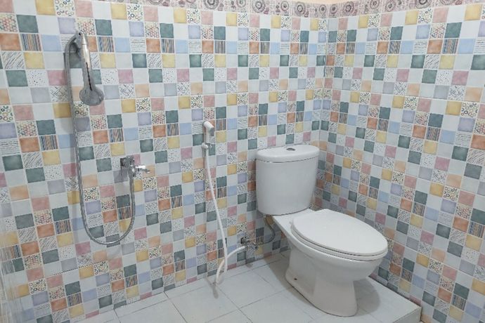 Imagen de la habitación del Hotel Oyo Homes 91098 Desa Wisata Tanjung Syariah. Foto 9