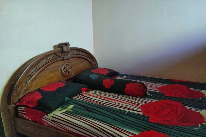 Imagen de la habitación del Hotel Oyo Homes 91098 Desa Wisata Tanjung Syariah. Foto 10