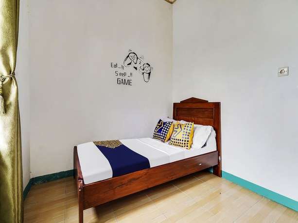 Imagen de la habitación del Hotel Oyo Homes 91128 Desa Wisata Lebakmuncang Ciwidey Syariah. Foto 3