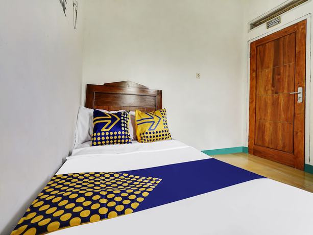 Imagen de la habitación del Hotel Oyo Homes 91128 Desa Wisata Lebakmuncang Ciwidey Syariah. Foto 4