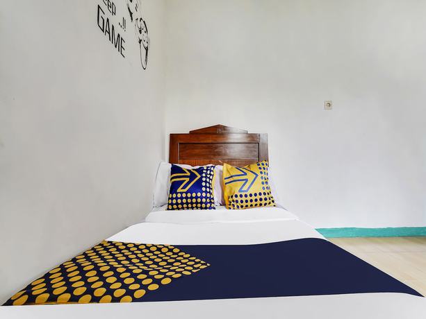 Imagen de la habitación del Hotel Oyo Homes 91128 Desa Wisata Lebakmuncang Ciwidey Syariah. Foto 7