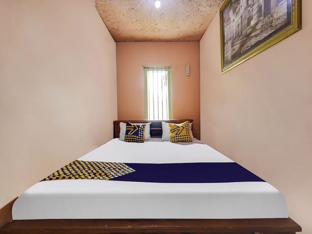 Imagen de la habitación del Hotel Oyo Homes 91128 Desa Wisata Lebakmuncang Ciwidey Syariah. Foto 10
