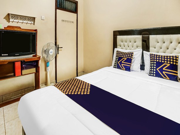 Imagen de la habitación del Hotel Oyo Homes 91133 Desa Wisata Sumber Agung Syariah. Foto 3