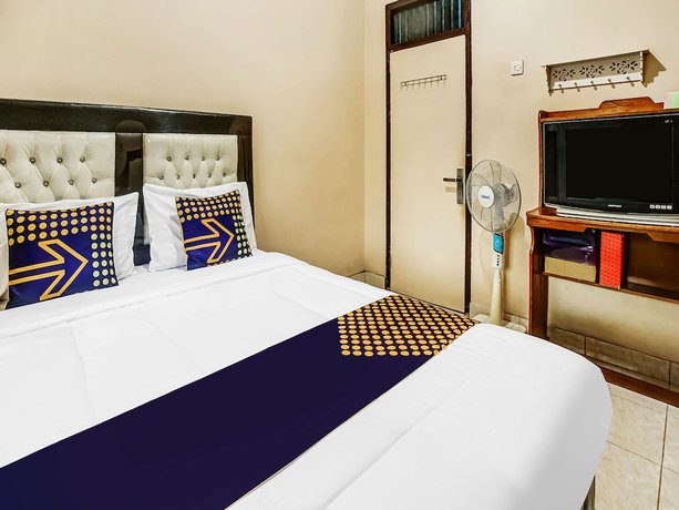 Imagen de la habitación del Hotel Oyo Homes 91133 Desa Wisata Sumber Agung Syariah. Foto 9