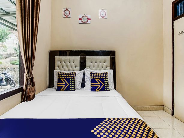 Imagen de la habitación del Hotel Oyo Homes 91133 Desa Wisata Sumber Agung Syariah. Foto 10