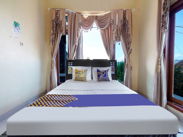 Imagen de la habitación del Hotel Oyo Homes 91156 Eco Tourism Big Farmer Desa Kertawangi Syariah. Foto 2