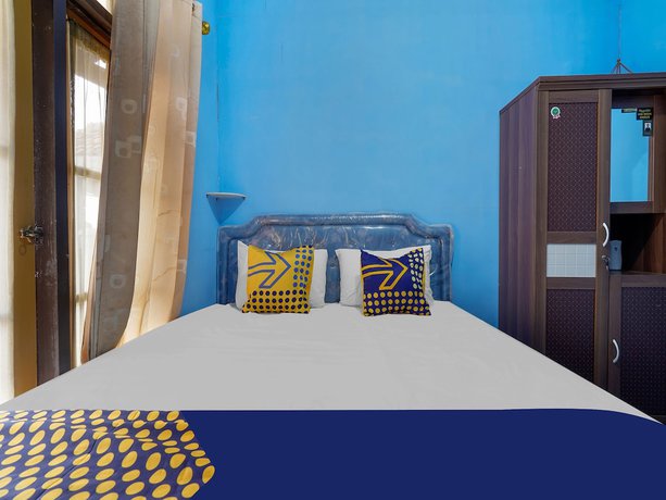 Imagen de la habitación del Hotel Oyo Homes 91156 Eco Tourism Big Farmer Desa Kertawangi Syariah. Foto 9