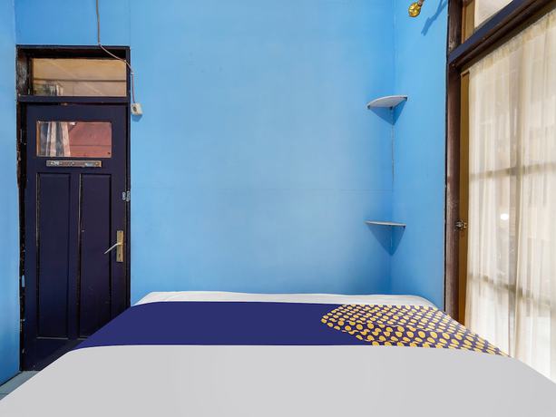 Imagen de la habitación del Hotel Oyo Homes 91156 Eco Tourism Big Farmer Desa Kertawangi Syariah. Foto 11