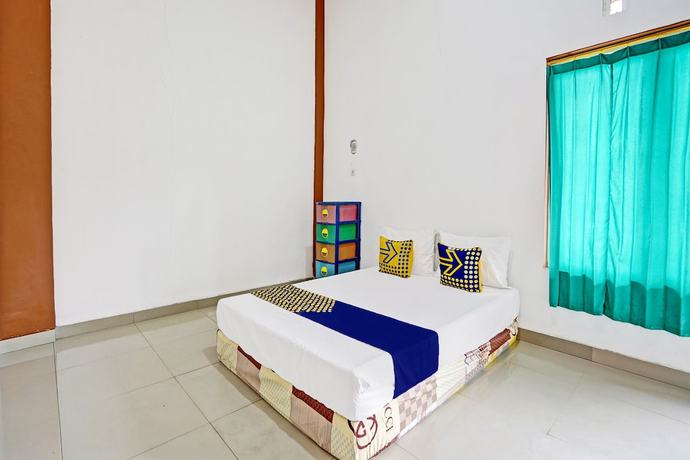 Imagen de la habitación del Hotel Oyo Life 93383 Wisma Kencana Puteri. Foto 1