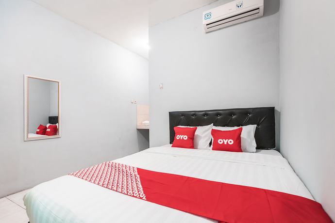 Imagen de la habitación del Hotel Oyo Living 1756 Amira Guest House. Foto 9