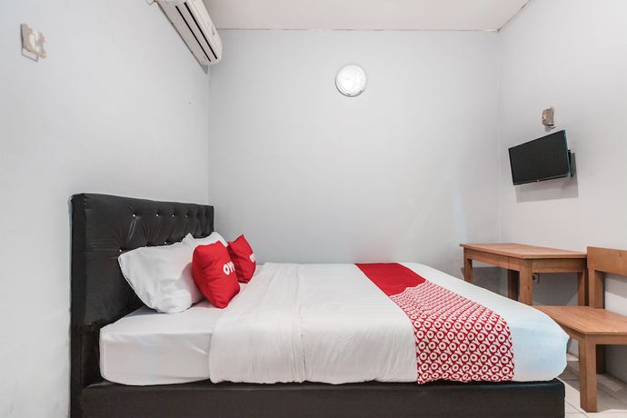 Imagen de la habitación del Hotel Oyo Living 1756 Amira Guest House. Foto 11