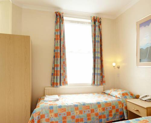 Imagen de la habitación del Hotel Oyo New Dome. Foto 6