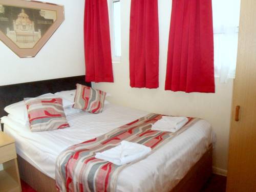 Imagen de la habitación del Hotel Oyo New Dome. Foto 7