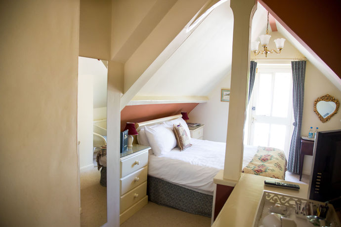 Imagen de la habitación del Hotel Oyo Orestone Manor. Foto 5