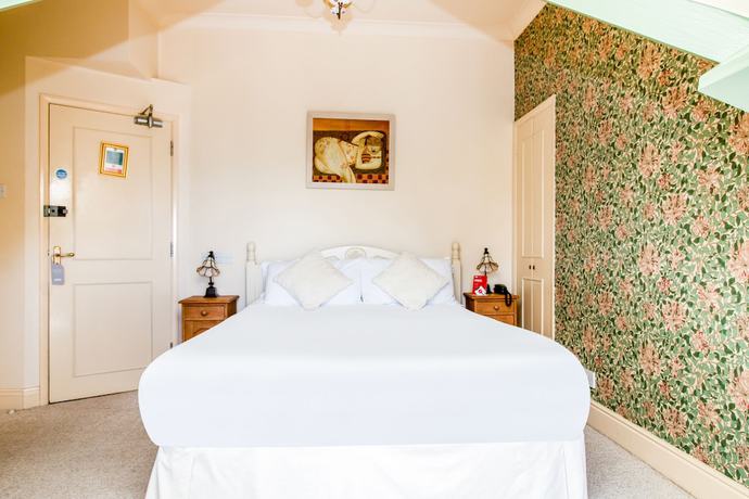 Imagen de la habitación del Hotel Oyo Orestone Manor. Foto 2