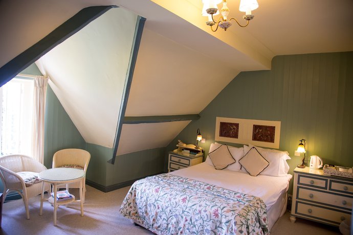 Imagen de la habitación del Hotel Oyo Orestone Manor. Foto 10