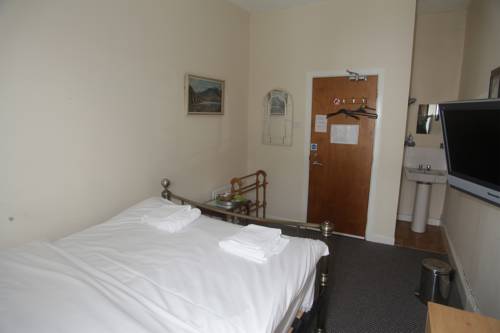 Imagen de la habitación del Hotel Oyo Queens Quarter. Foto 7