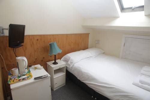 Imagen de la habitación del Hotel Oyo Queens Quarter. Foto 8