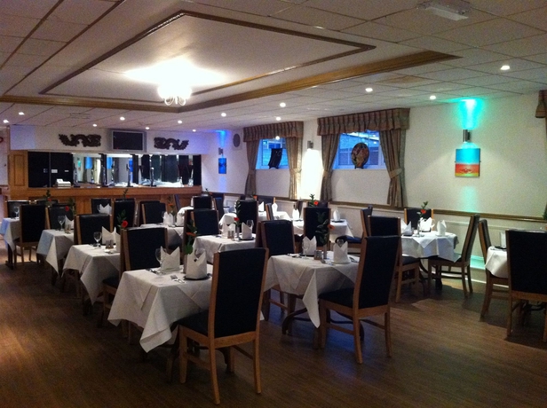 Imagen del bar/restaurante del Hotel Oyo Shilton Inn. Foto 4