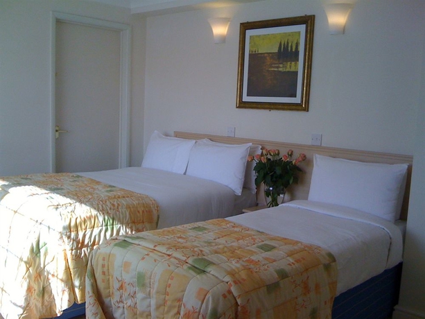 Imagen de la habitación del Hotel Oyo Shilton Inn. Foto 8