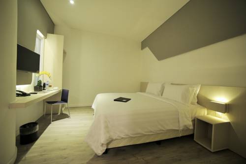Imagen de la habitación del Hotel Ozone Pantai Indah Kapuk. Foto 1