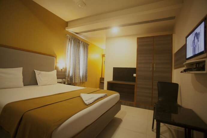 Imagen de la habitación del Hotel P K Rresidency. Foto 13