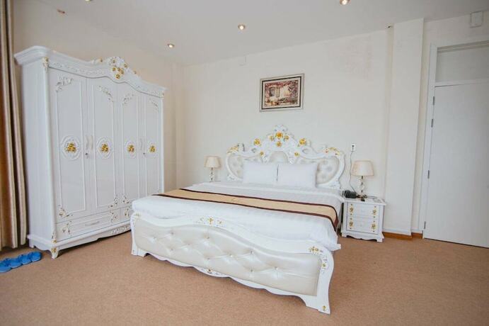 Imagen de la habitación del Hotel PAPA DONG HOI HOTEL. Foto 10