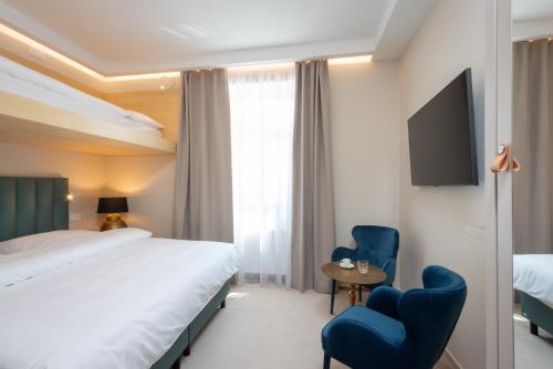 Imagen de la habitación del Hotel PAPPAS hotel&studio. Foto 20