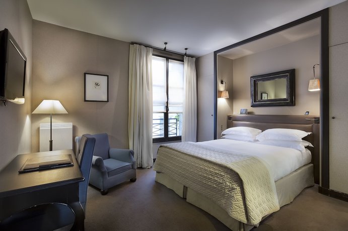 Imagen de la habitación del Hotel PAVILLON DE LA REINE. Foto 16