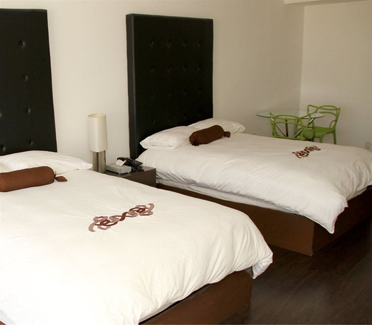 Imagen de la habitación del Hotel PIA SUITES. Foto 2