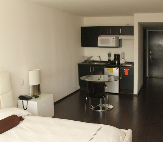 Imagen de la habitación del Hotel PIA SUITES. Foto 7