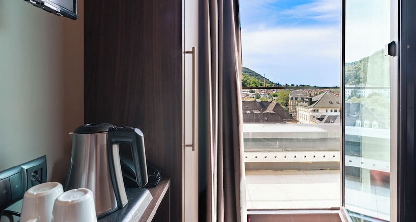 Imagen de la habitación del Hotel PLAZA Premium Heidelberg. Foto 3