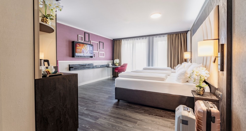 Imagen de la habitación del Hotel PLAZA Premium Heidelberg. Foto 7